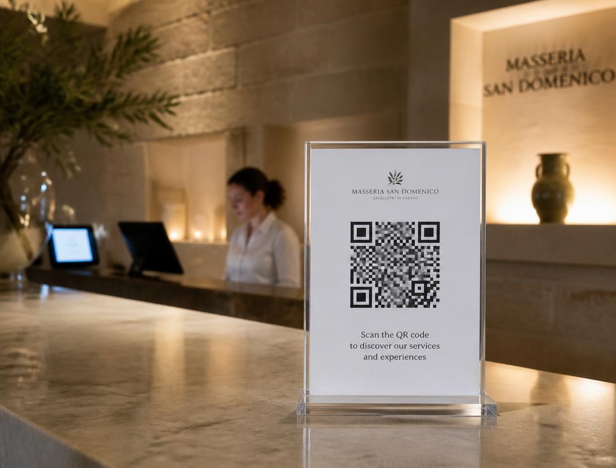 Boutique hotel reception with a QR sign